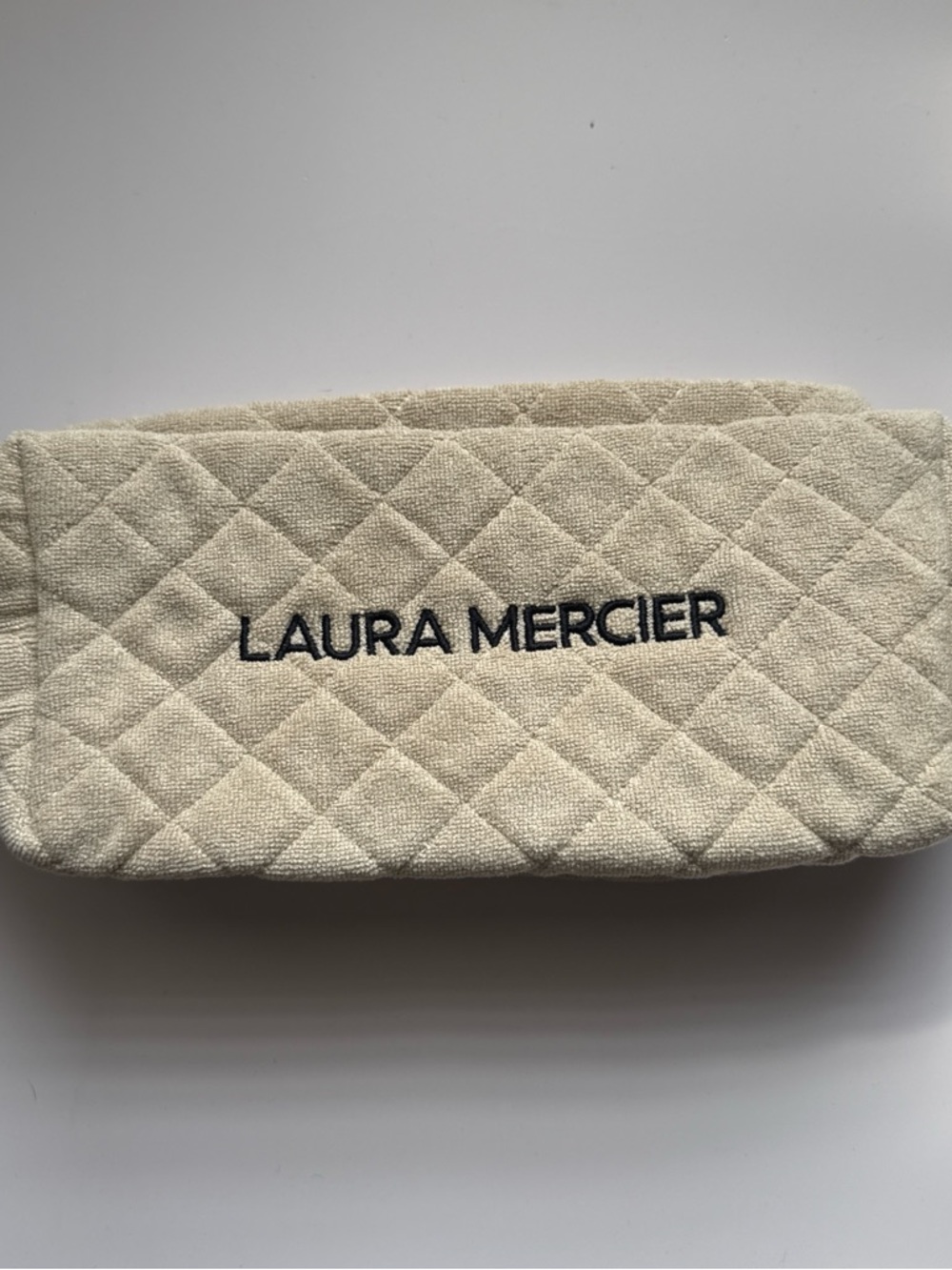laura mercier Quilted Cream Cosmetic Case with Black Logo